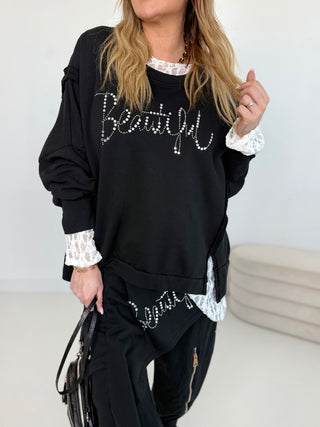 Sweater in Schwarz mit glänzenden Steinchen vorne