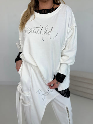 Sweater in Weiss mit glänzenden Steinchen vorne